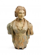 This is an image of a carved and polychromed pine young girl figurehead made in the early 19th century.