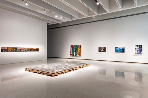 This image is an installation view of the exhibition Working Thought on view at the Carnegie Museum of Art, which includes an artwork by Tomashi Jackson.